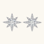 Sterling silver star-shaped stud earrings with brilliant moissanite center stones and pavé details on neutral background.