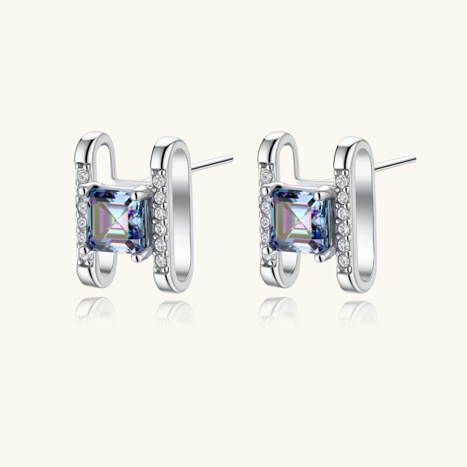 Square moissanite studs in sterling silver geometric setting showing rainbow prismatic fire on white background.