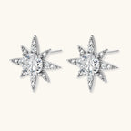 Sterling silver star-shaped stud earrings with brilliant moissanite center stones and pavé details on neutral background.