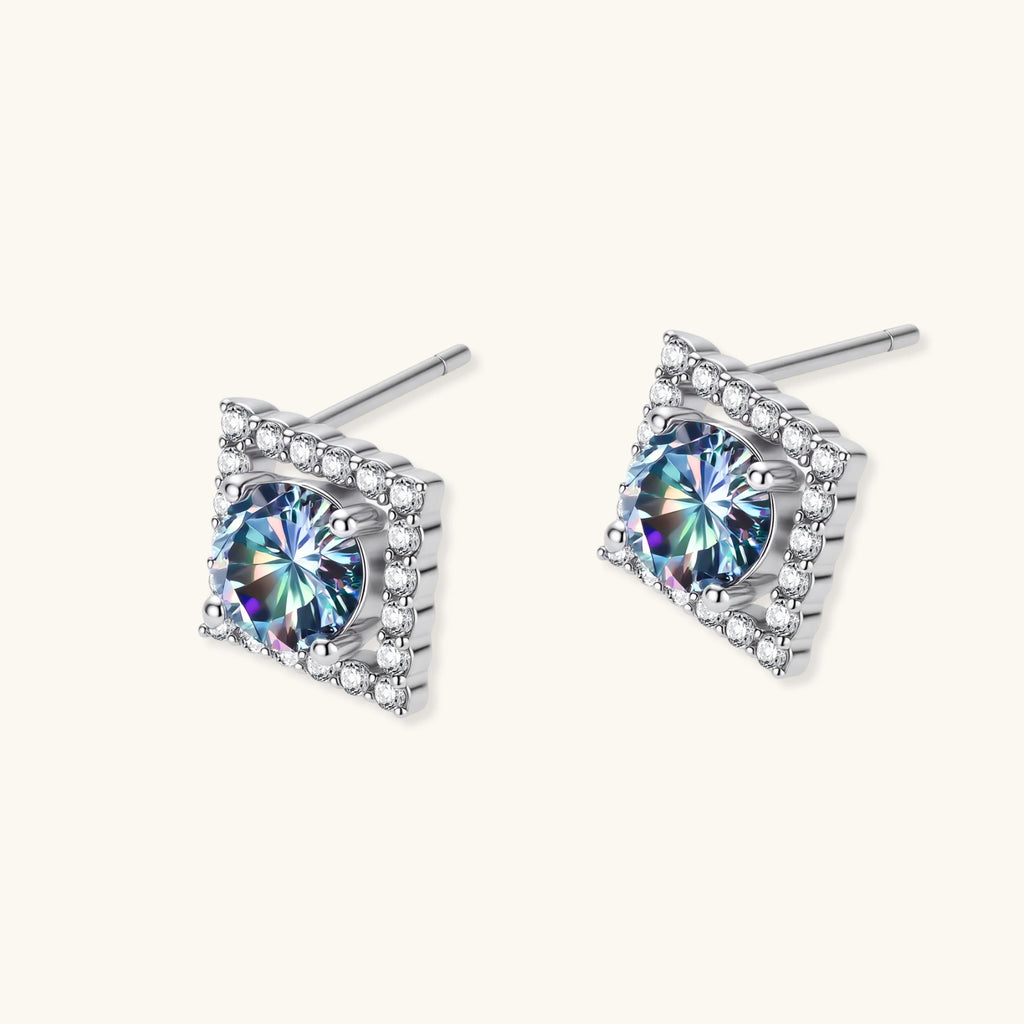 Diamond-shaped sterling silver stud earrings with rainbow moissanite centers surrounded by crystal halos