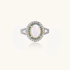 Vintage-style cocktail ring with luminous cat's eye center stone surrounded by turquoise and crystal double halo on white gold plated band